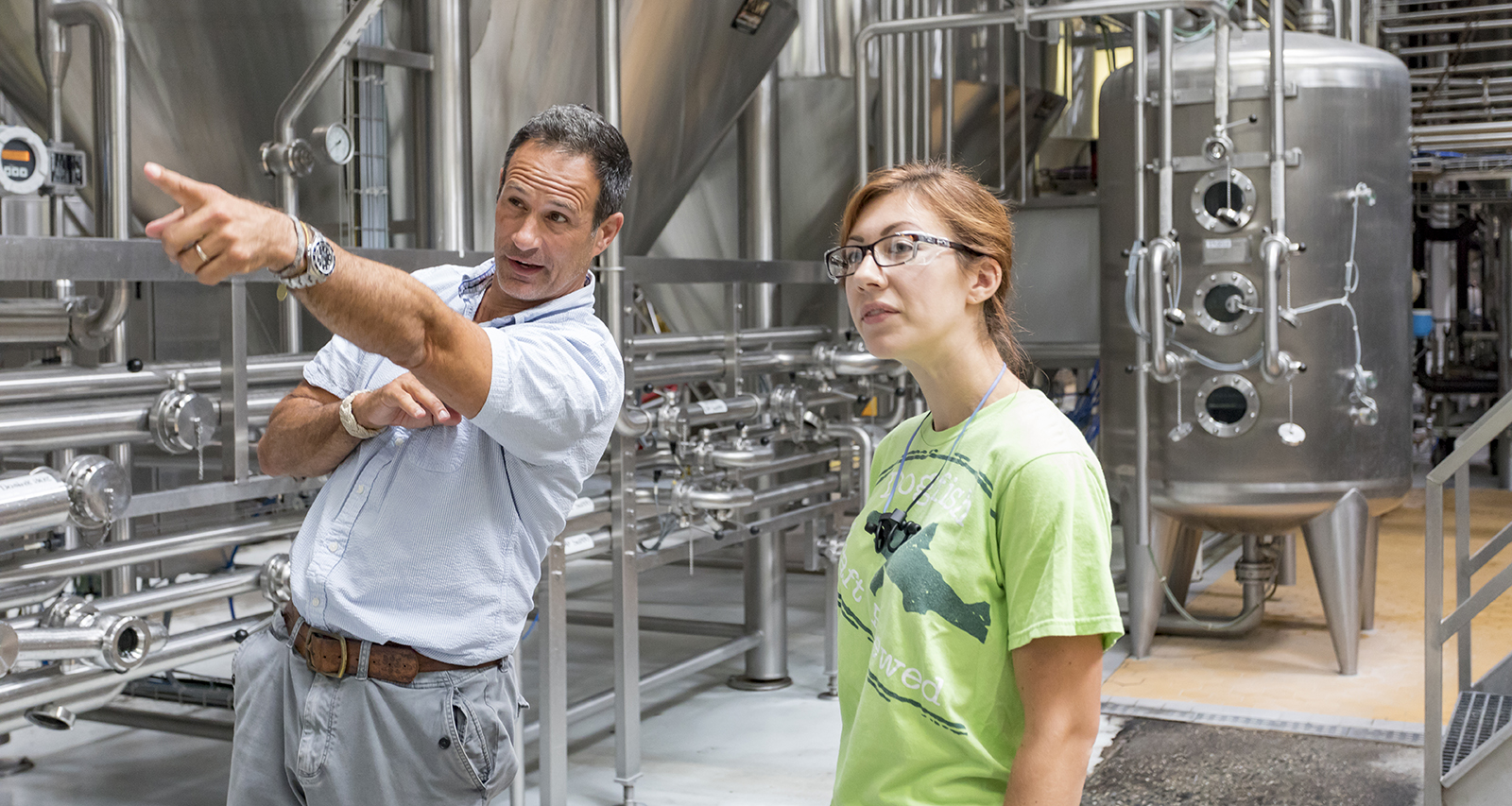 Sam Calagione '92 with brewer at Dogfish Head brewery.